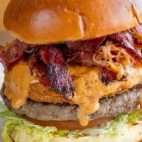 Wild Western Burger · Our famous 1/3 lb. beef patty topped with homemade onion rings, house-smoked grilled pastram...