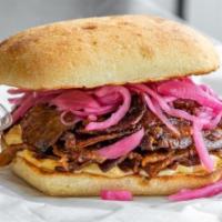 Bbq Beef Sandwich · *NEW* Tender caramelized BBQ roast beef, pickled red onion and a touch of Jeff's aioli on a ...