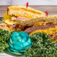 Egg, Ham & Cheese Sandwich · Our specially prepared egg petty, ham steak, and melted cheeses.
