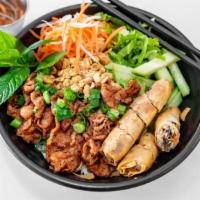 Charbroiled Meat & Egg Roll Vermicelli · Vermicelli served with pickled carrots and daikon, lettuce, bean sprouts, topped with toaste...