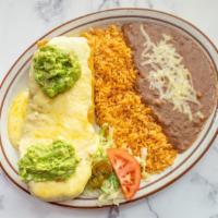 Chimichanga · One tortilla deep fried, filled with your choice of shredded beef or chicken. Covered with c...
