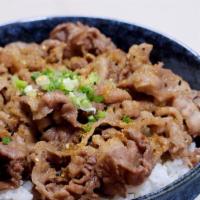 Gyudon · Rice topped with beef and onion simmered in a mildly sweet sauce.