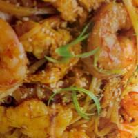 Pad Thai · Hot and spicy. Thai glass noodles with chicken, shrimp, bean sprouts, onions, eggs, and grou...