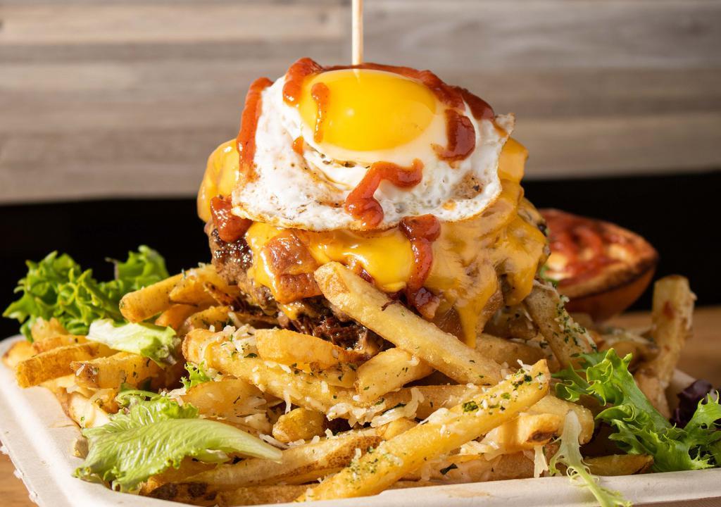 Napoleon Burger · braised short rib, bacon, spring mix, caramelized onion, american, cheddar, smoked gouda, truffle parmesan fries, fried egg, korean aioli, tomato jam