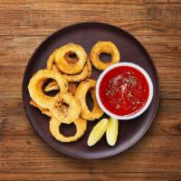 Onion Crisp · Onions sliced to rings dipped in a batter and then deep fried till golden and crisp.
