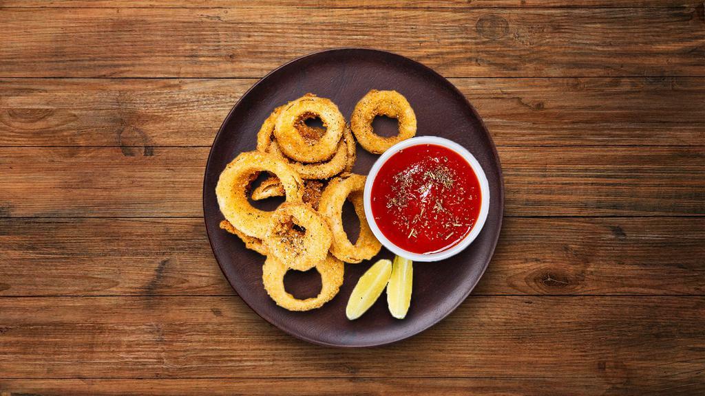 Onion Crisp · Onions sliced to rings dipped in a batter and then deep fried till golden and crisp.