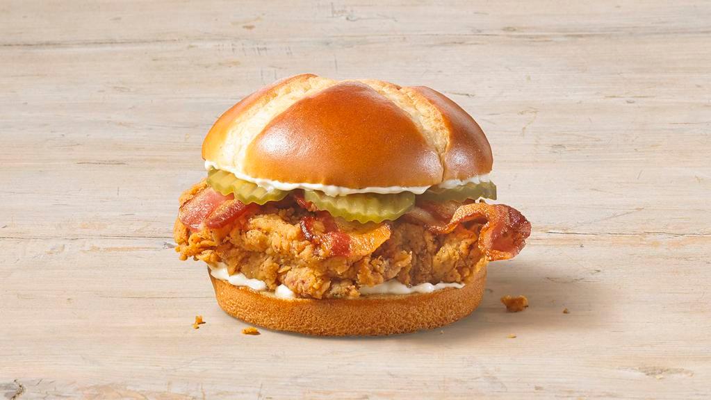 Spicy Chicken Sandwich With Bacon · We placed over 65 years of delicious into this sandwich. Taste our legendary hand-battered chicken, topped with a signature honey-butter brushed brioche bun with mayo and pickles.
