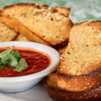 Garlic Bread · A Masa Cuban roll with olive oil, fresh garlic & parmesan served with marinara