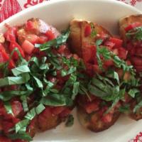 Bruschetta · Roma tomatoes with fresh basil, garlic, olive oil, and balsamic vinegar on a toasted Masa Cu...
