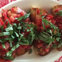 Vegan Bruschetta · Roma tomatoes with fresh basil, garlic, extra virgin olive oil and balsamic vinegar on a toa...