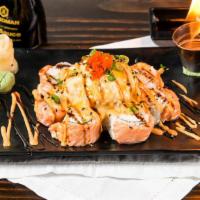 Awesome · Inside: crab meat, cucumber,  topped: salmon, dynamite, cheese,  served with khanya sauce an...