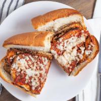 Eggplant Parmesan Sub · Serve on a French Roll. Breaded eggplant over house marinara sauce, top with vegan mozzarell...