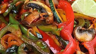 Vegetable Fajitas · marinated in special spices sautéed with mushrooms, bell peppers and onions garnished with guacamole

served with rice, whole beans and tortillas