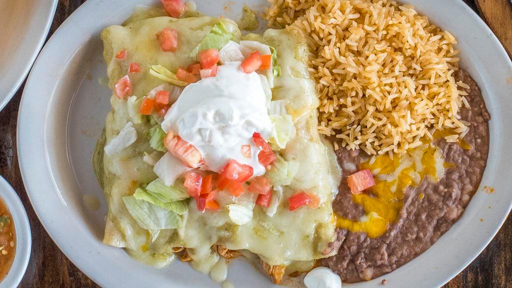 Enchilada Suizas · Two shredded chicken enchiladas with our savory, creamy green salsa and jack cheese garnished with sour cream. Served with rice and sweet corn.
