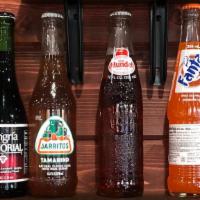 Soda De Botella · Bottled soda. Coca-Cola, Sprite, Orange Fanta, Sangria Señorial, Jarritos Tamarind, Sidral M...