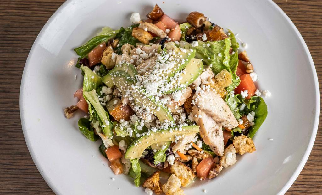 Mighty Roasted Chicken · Dates, walnuts, goat cheese, corn, tomatoes, avocado, house croutons, champagne vinaigrette.