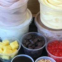 Family Pack - Large · 4 Pints Soft Serve (choose up to 4 flavors), 
2 Cups Toppings (choose up to 6 toppings)