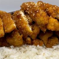Sesame Chicken · Breaded chicken breast, deep fried then topped with sauce.