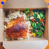 Blackened Salmon · Blackened wild-caught Atlantic Salmon, brown rice and grilled vegetables.