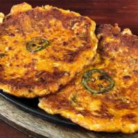 Kimchi Jeon · Mixed flour pancakes made with finely chopped kimchi and spam.