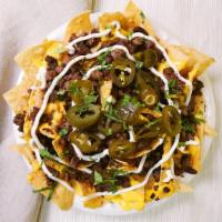 Special Nachos · Homemade fried tortilla chips served with your choice of meat, beans, nacho cheese, sour cre...