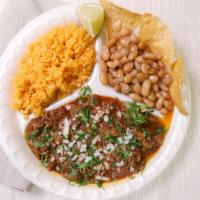 Birria De Res · Marinated pulled beef, topped with onion and cilantro, tortillas (4) side of rice and beans.