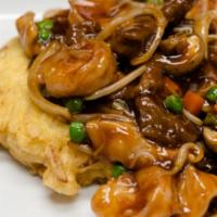 House Special Egg Foo Young · Deep fried vegetables and egg patty, top with vegetable in brown sauce with chicken, beef an...