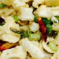 Calamari With Pepper And Salt · Lightly breaded calamari deep fried to crispy, then stir-fried with salt and pepper on top o...
