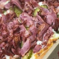 Pastrami Pizza · Pastrami, mustard, pickles, and mozzarella cheese.