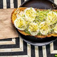 Avocado & Egg Toast  · Cream cheese, avocado, boiled egg, and sprouts on multigrain toast.