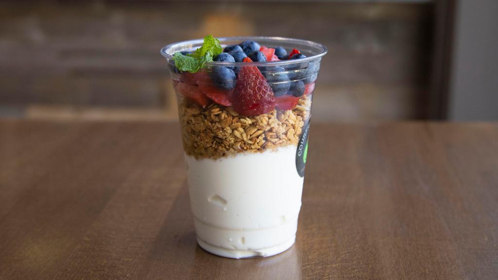 Yogurt Parfait · Organic Greek vanilla yogurt, seasonal fresh fruit, hearty granola with almonds and honey.