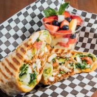 Chicken Caesar Wrap · Served with chicken breast, romaine lettuce, shredded Parmesan cheese, tomato wrapped in a f...