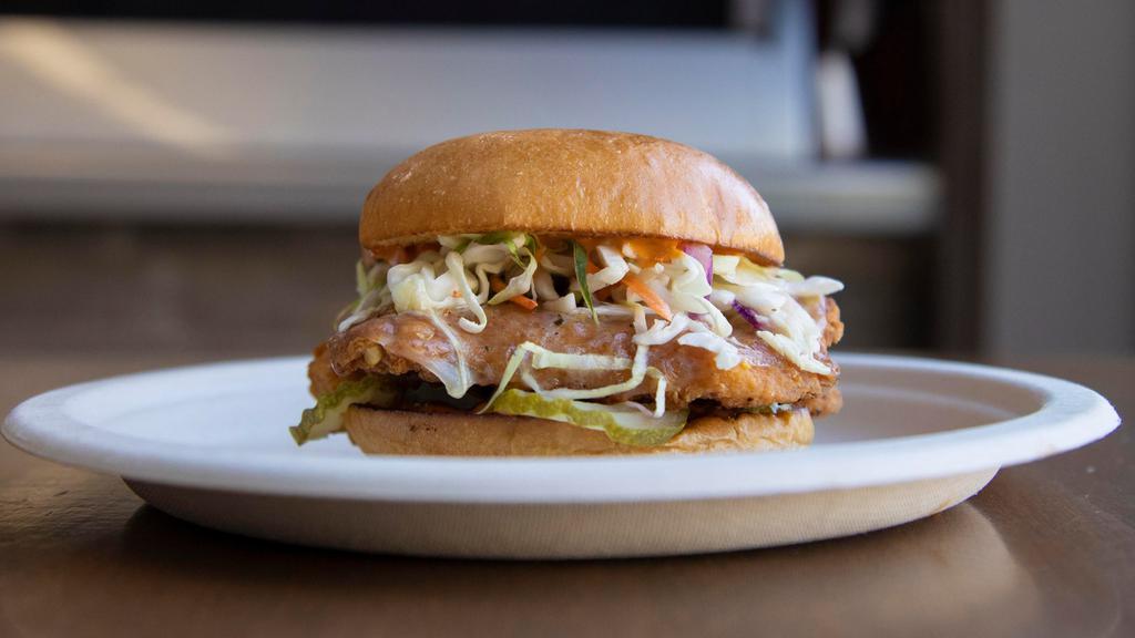 Fried Chicken Sandwich · Our delicious fried chicken sandwich. Served on a brioche bun with provolone cheese, coleslaw, chipotle aioli and pickles