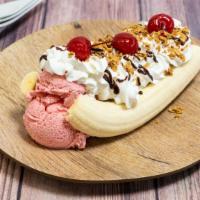 Banana Split · Banana cut in half, with 3 scoops of ice cream of your choice, covered with whipped cream an...