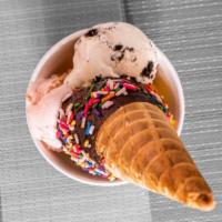 Large Waffle Cone · Double scoops of Ice cream in a double scoops cup, served with a small waffle cone on the si...