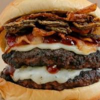 Rodeo Double Burger · Certified Angus Beef.  This double cheeseburger has some kick.  It comes with Sante Fe BBQ s...