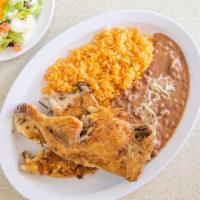 Pollo Asado · Half grilled chicken with French fries, salad, and tortillas.
