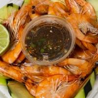 Camarones Culiacán · Camaron cocido con cabeza, pepino, con nuestra salsa picosa aun lado y limón.
(Boiled shrimp...