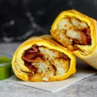 Bacon, Egg, And Cheddar Breakfast Burrito · 3 fresh cracked, cage-free scrambled eggs, melted Cheddar cheese, smokey bacon, and crispy p...