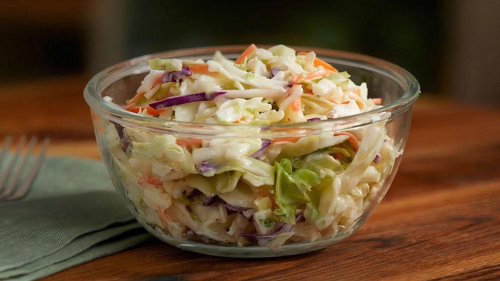 Cole Slaw (Individual) · Housemade with a mix of green cabbage, red cabbage and carrots tossed in a Coleslaw dressing. .