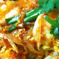 Pad Thai · Stir-fried thin rice noodles with egg, tofu, bean sprouts, green onion, grounded peanut. Ser...