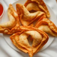 Cheese Wontons (6) · Deep-fried cream cheese wrapped in wonton skin, served with sweet and sour sauce.