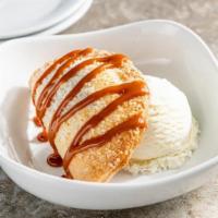 Apple Em-Pie-Nada · Classic hand pie, served with vanilla ice cream and a caramel drizzle.