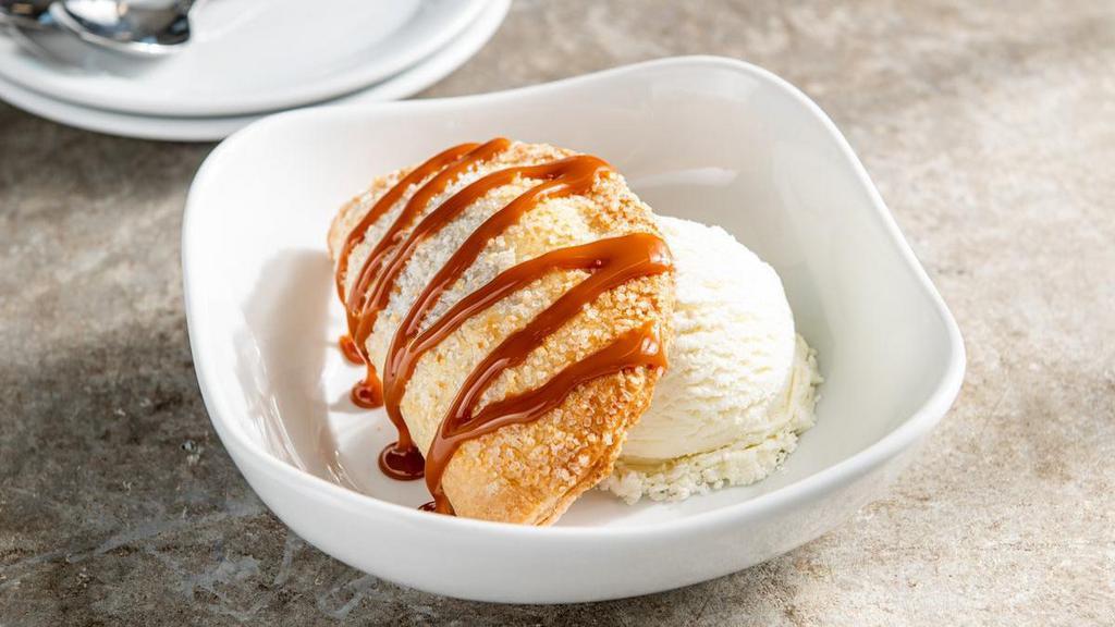 Apple Em-Pie-Nada · Classic hand pie, served with vanilla ice cream and a caramel drizzle.