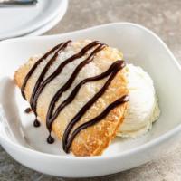 Hershey'S® Chocolate Em-Pie-Nada · Classic hand pie, served with vanilla ice cream and a fudge drizzle.