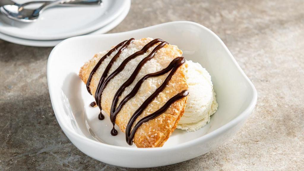 Hershey'S® Chocolate Em-Pie-Nada · Classic hand pie, served with vanilla ice cream and a fudge drizzle.