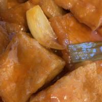 Sweet And Sour Tofu · fried tofu with onion, pineapple, carrots and bell pepper in sweet and sour sauce