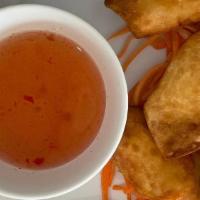 Crab Rangoon (6 Pcs.) · Egg paper wrap with crabmeat, cream cheese, white onions, green onions served w/ sweet garli...