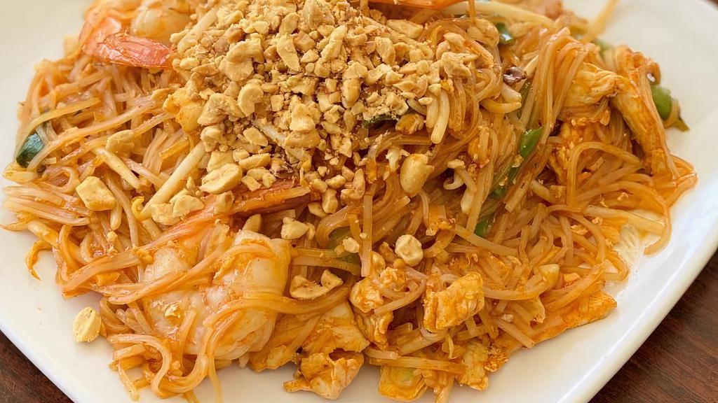 Pad Thai · Pan fried rice noodles, bean sprouts, green onions, Tamarind sauce served with crushed peanuts. Please specify your meat choice, chicken or pork or beef.