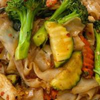 Pad Kee Mao · Spicy pan fried wide rice noodles, broccoli, carrots, basil, bell peppers, zucchini, and gre...